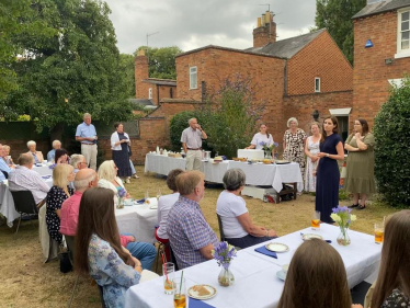 Aphra during her speech in the gardens